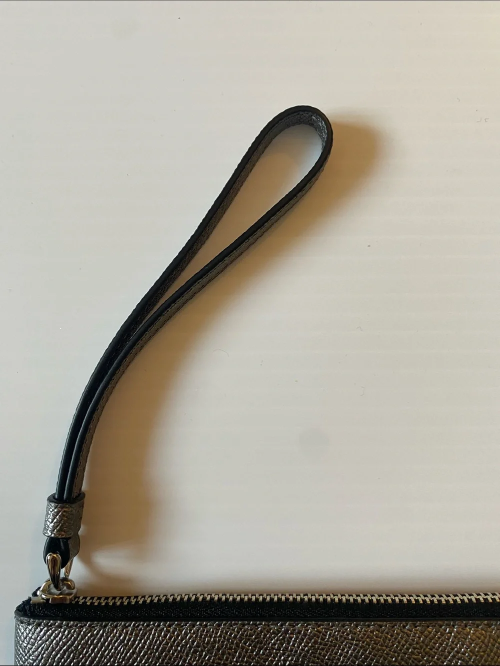 Coach Corner Zip Leather Wristlet in Silver and Black. F21070
